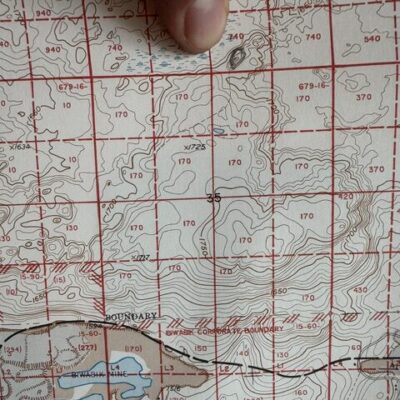 Ed Turk circled the spot in the Superior National Forest where he and the Sawyer boys built a hunting shack. Tom searched for it in The Movie: Woods of Biwabik, and he phoned Ed from deep in forest.  